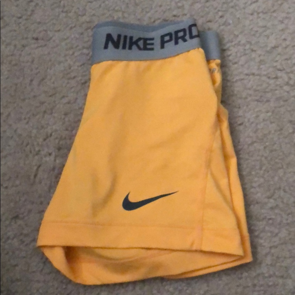 Neon orange Nike pros